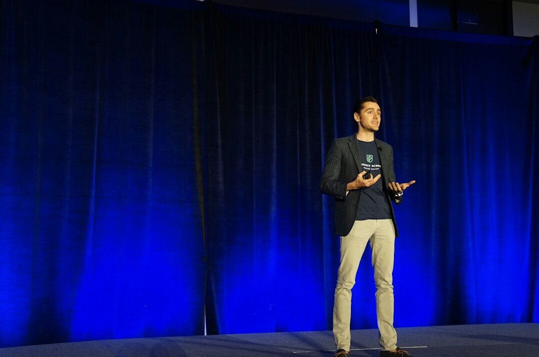 executive speaking on stage