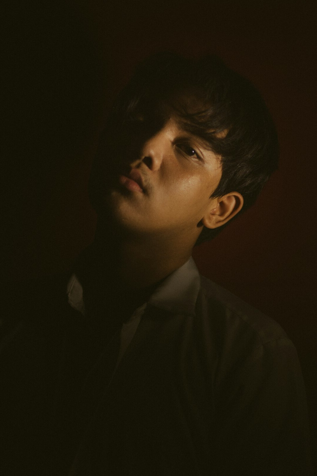 Studio portrait of a man in a dark suit