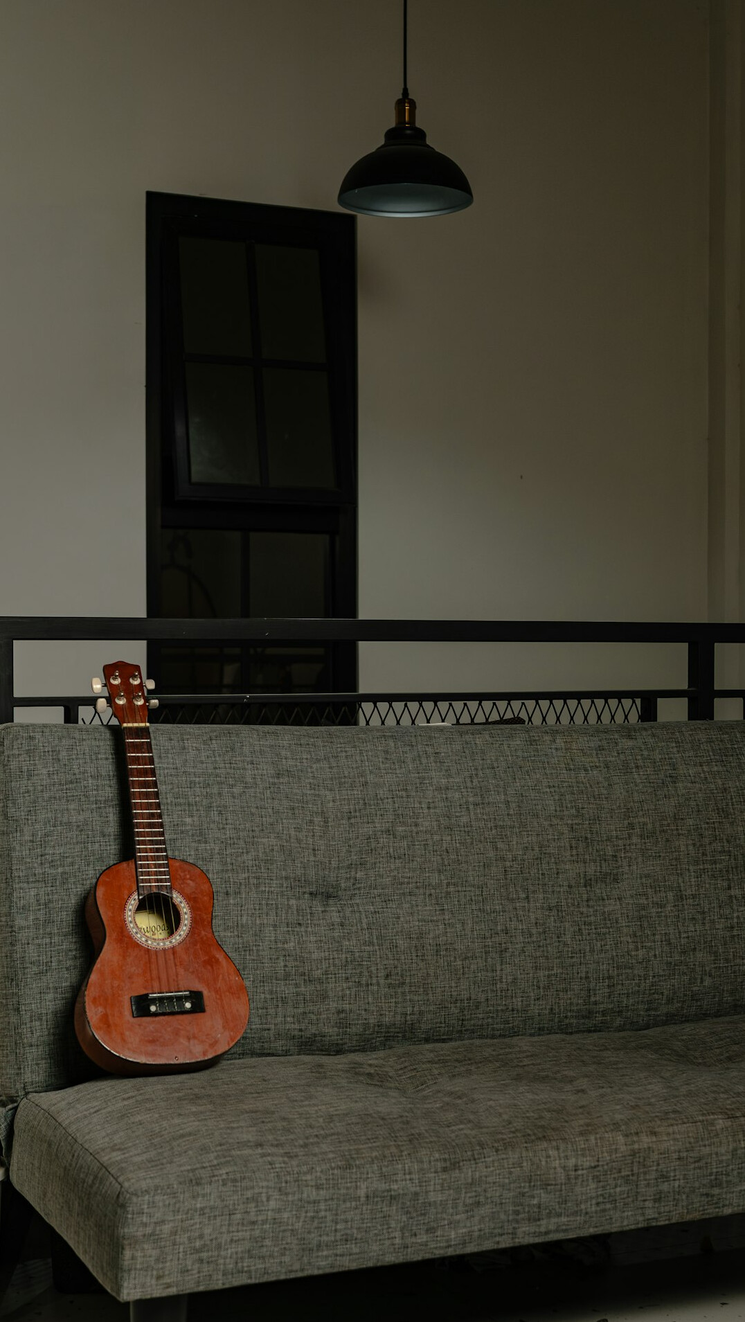 Studio microphone with warm side lighting in a quiet acoustic room