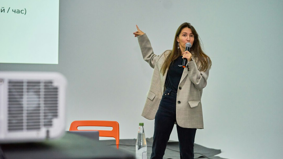 executive speaking on stage