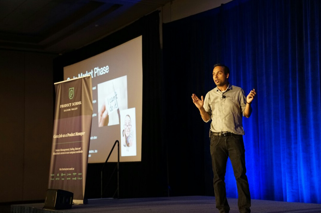 executive speaking on stage